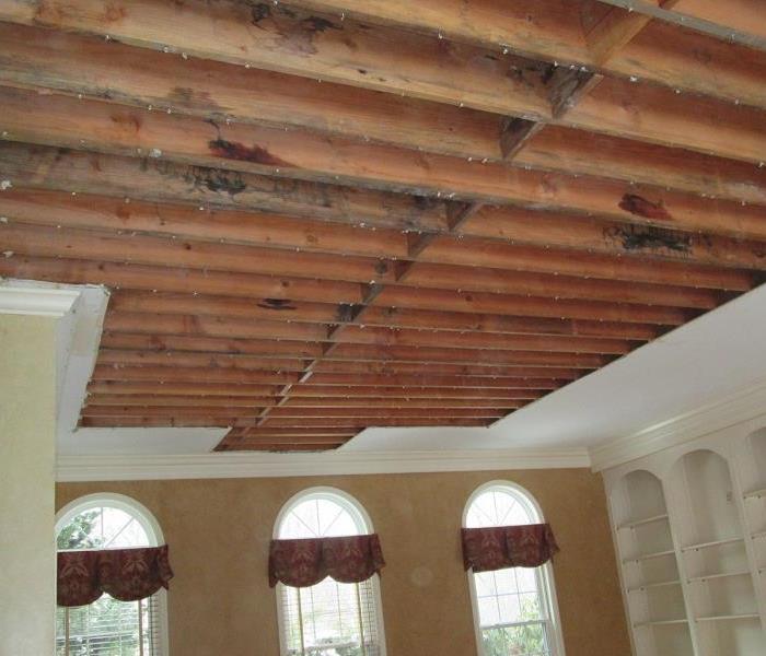 photo of damaged ceiling being removed