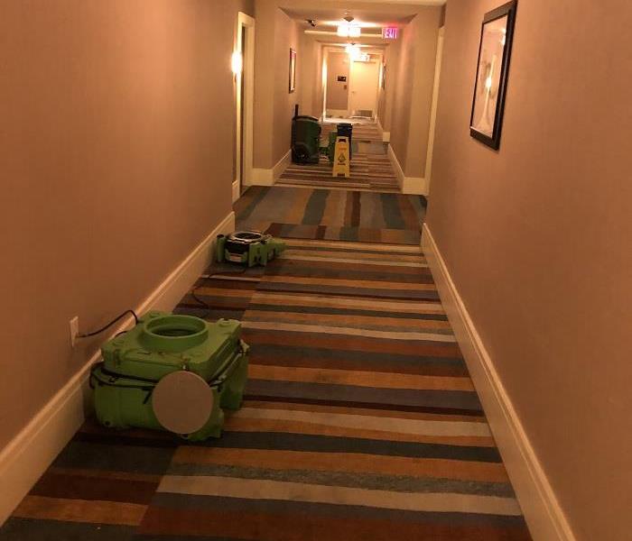 Photo of hotel hallway with drying equipment