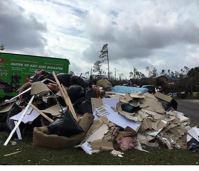 Large debris piled outside a home in Florida after the hurricane.  