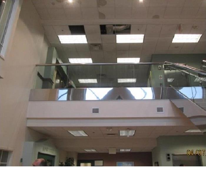 water damage to the ceiling tiles at a large bank headquarters