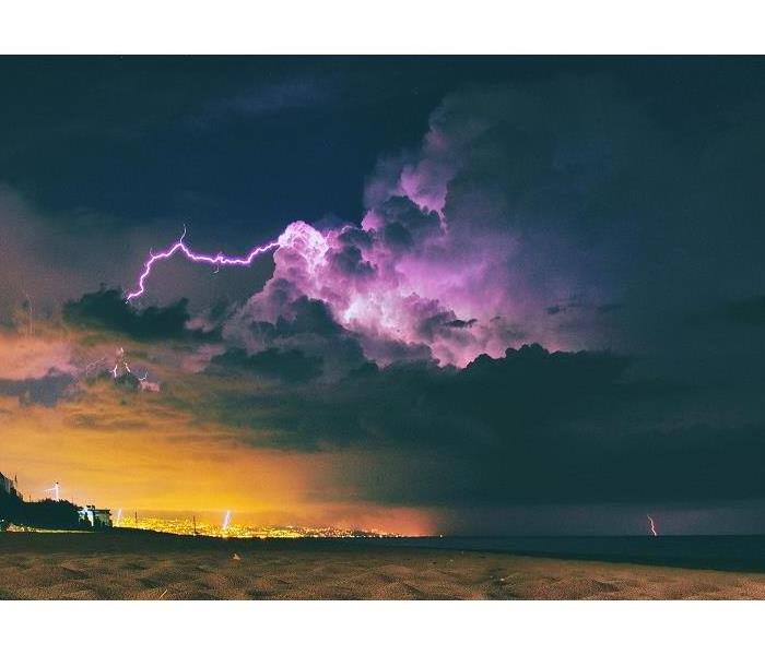 clouds and lightning over a beach